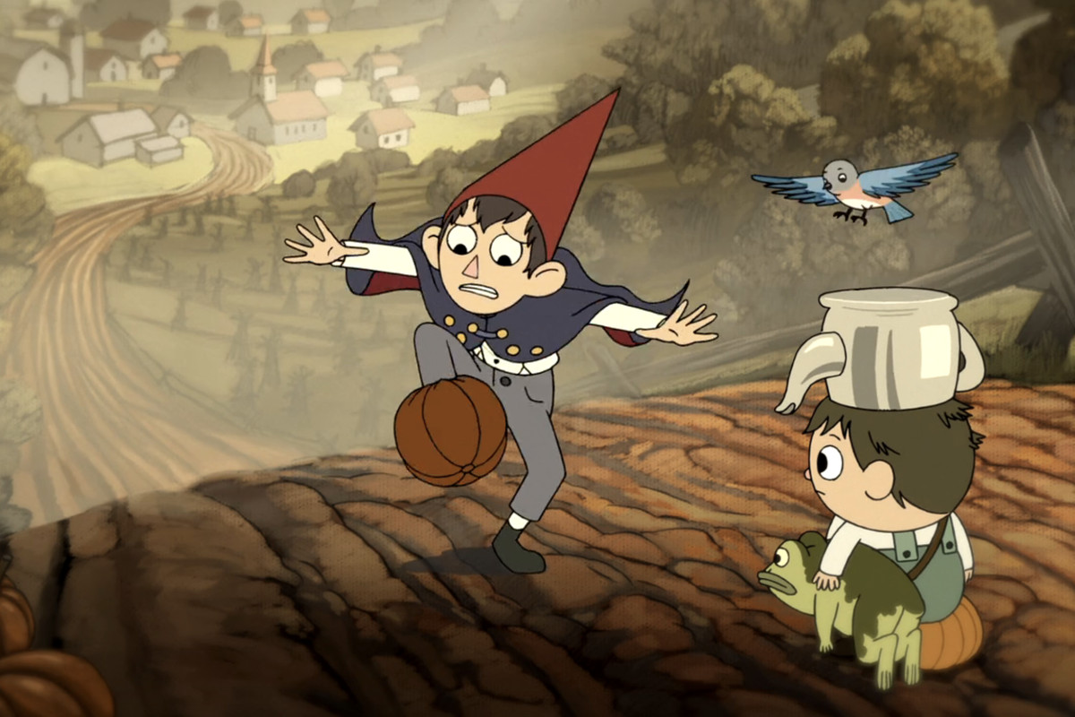 Two young children in Over the Garden Wall. One wears a point red hat and has his foot in a pumpkin. Another wears a pot on his head and holds a frog. A blue bird flies near them.